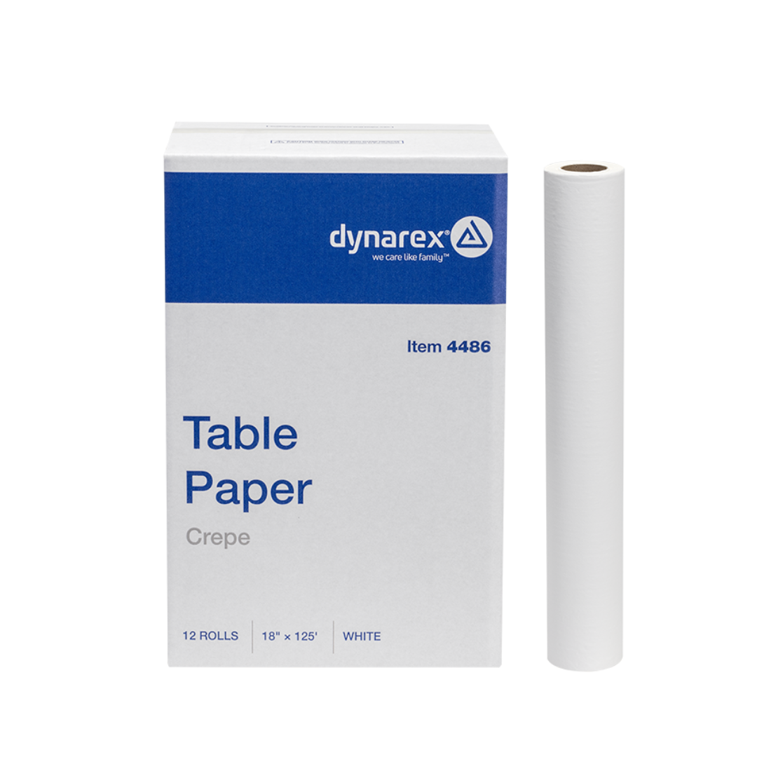 A box labeled Dynarex Exam Table Paper with a white exam paper roll beside it. The packaging indicates 12 rolls of 18 x 125 inch protective barrier paper for medical exam tables.